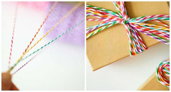 Emballage cadeau avec du papier kraft et des fils multicolores