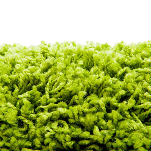 Une surface texturée verte qui ressemble à une moquette à poils longs.
